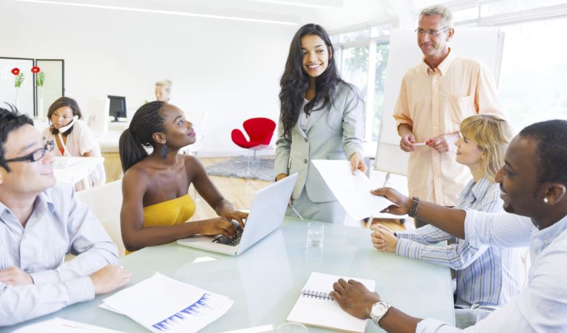 Group of people talking at table